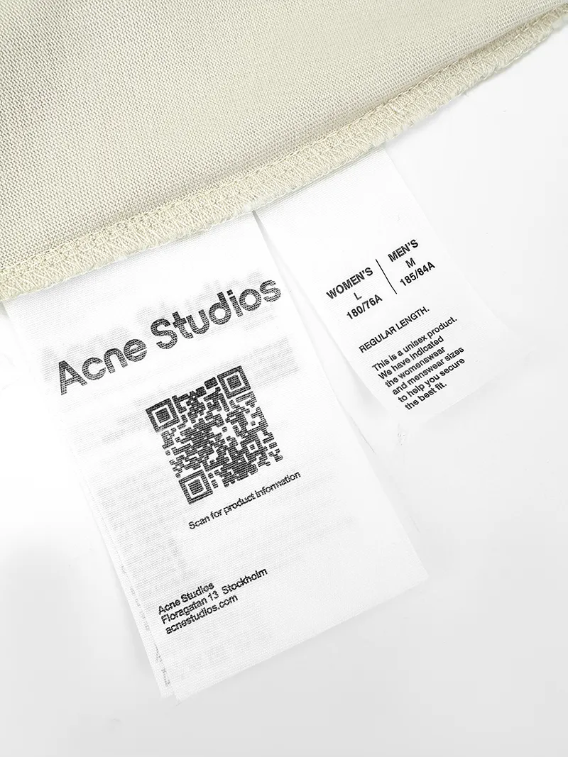 Acne Studios printed distressed long sleeves. Customized air oxygen soft matt jersey. Smooth and delicate. Comfortable and skin-friendly. Cream White base color. Retro luxury hidden in the distressed texture. Relaxed and high-end. The front and back are engraved with flame gothic fonts. Acne Studios' dark subculture edge flows naturally. Hand-carved holes and worn details. Replicate the wild texture accumulated over time. The ultimate interpretation of the luxurious collision of Nordic minimalist style and street rebellious spirit. Process 1: Use glue printing process. The chest printing has been modified three times with the film screen. Use glue liquid paint to print the pattern on the fabric. Bake the fabric to fix the printed pattern. Process 2: Many parts of the body are worn by pure manual regular positioning. Manual brushing marks add texture and depth to the surface of the clothing to imitate the texture of natural wear. Process 3: The fabrics have been fermented and washed. The texture is better, not easy to deform, not easy to shrink, not easy to fade, and maintains long-term beauty. Accessories: Customized 1:1 Acne trademark Fit: Loose fit Size: S M L XL Style number: BB